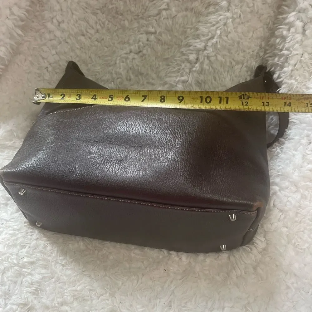 Maxx New York Leather Brown medium shoulder bag with silver tone hardwares.